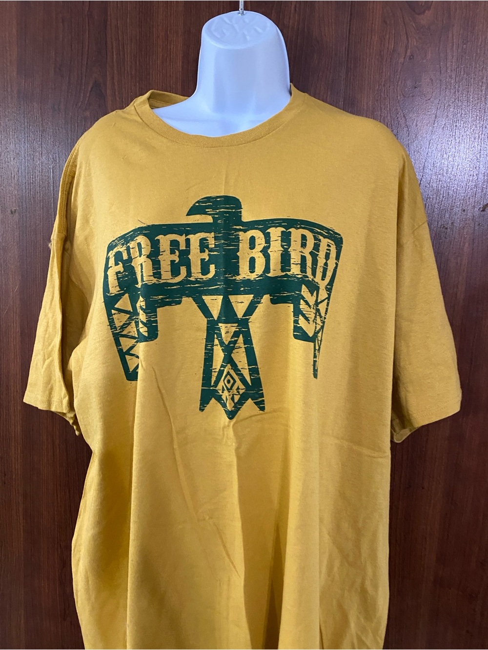 Delta Mustard Yellow Tee with Dark Green Free Bird Graphic unisex. NWT